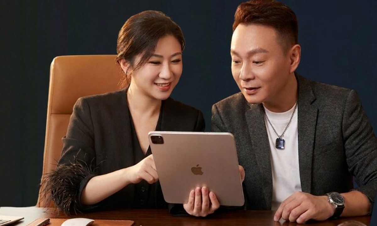 Stan and Cat reviewing property strategy on a tablet